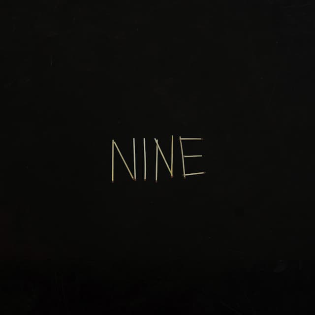 NINE cover